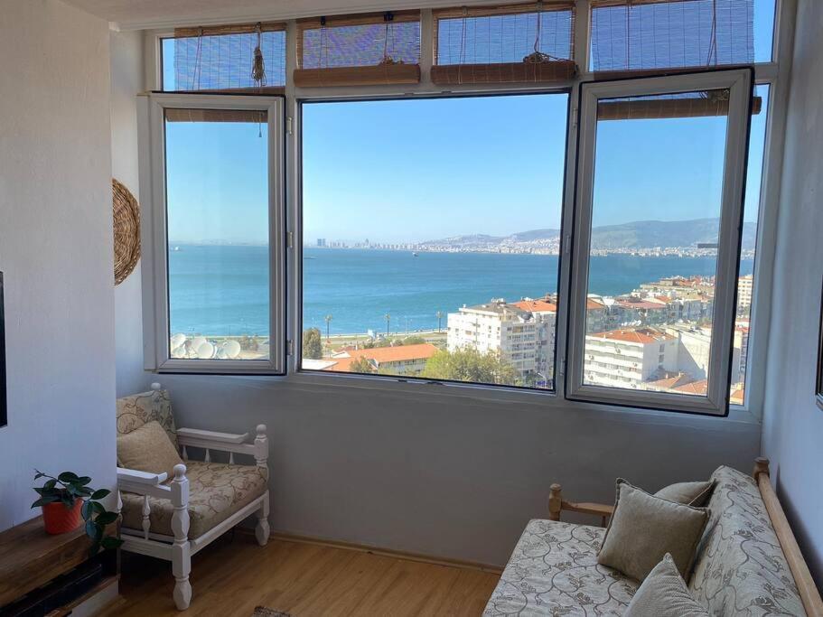 a living room with a view of the ocean at Penthouse with unique sea view and private terrace in Konak