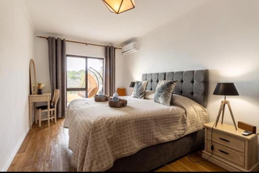Кровать или кровати в номере Apartamento Bela Vista Leni
