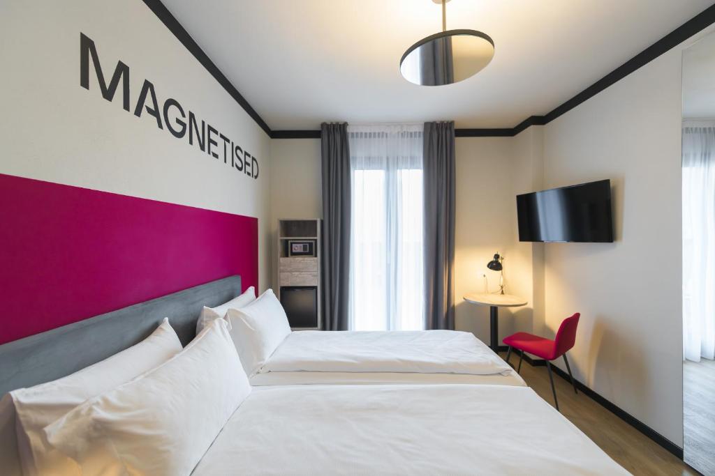 Łóżko lub łóżka w pokoju w obiekcie Hotel Villa Dirce