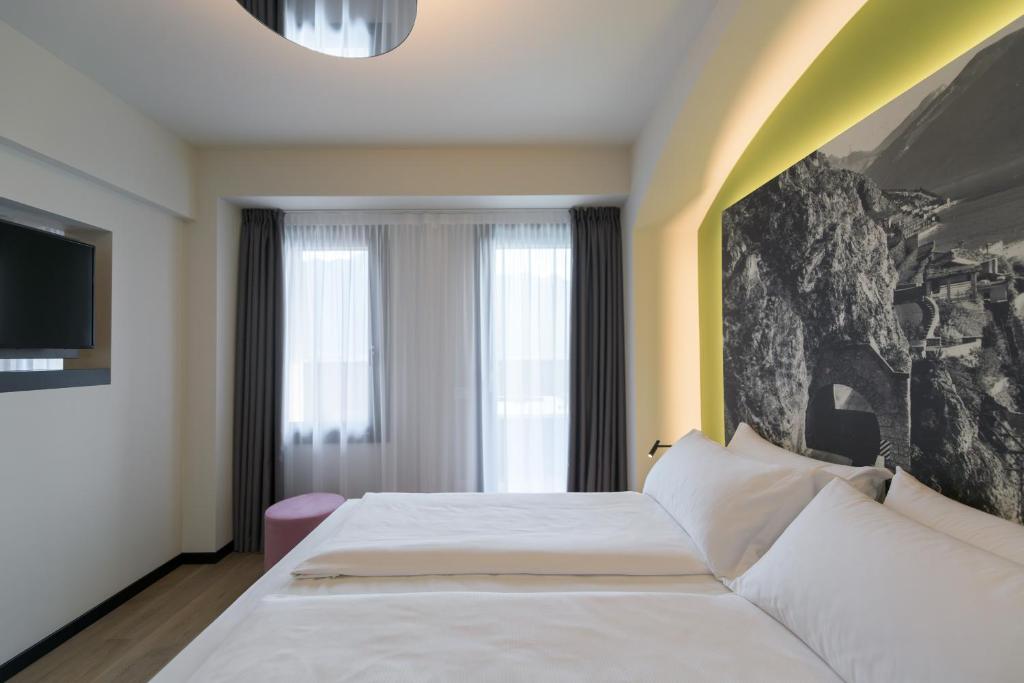Łóżko lub łóżka w pokoju w obiekcie Hotel Villa Dirce