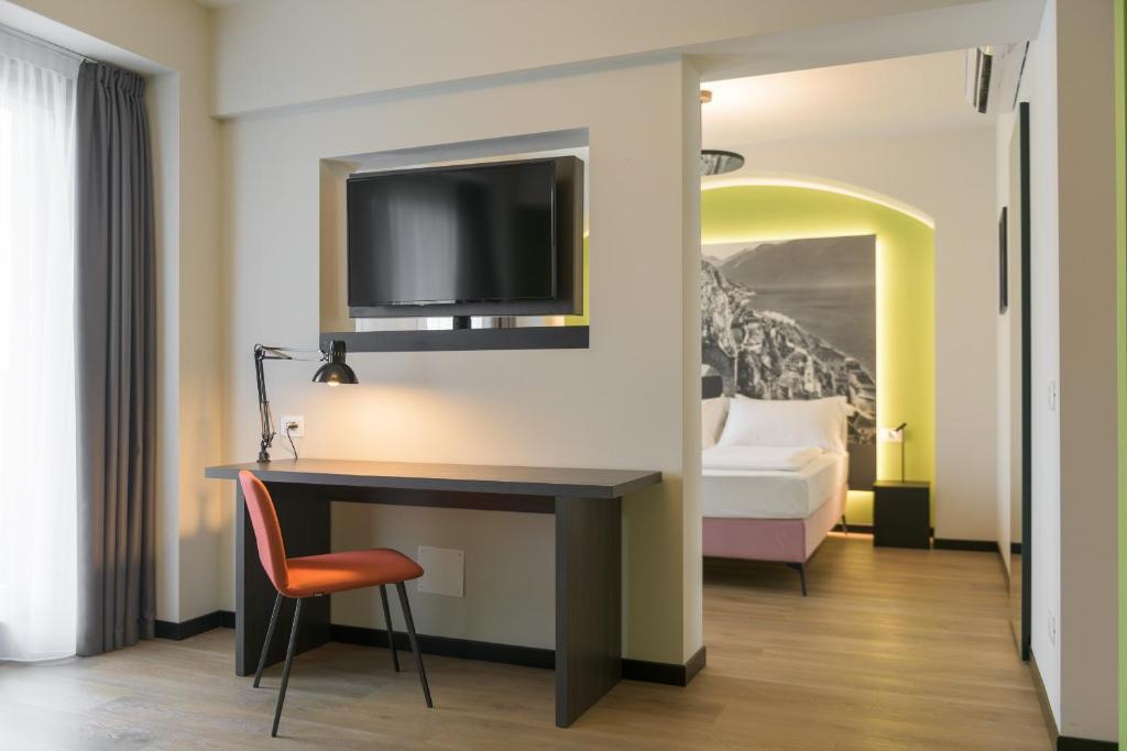 Łóżko lub łóżka w pokoju w obiekcie Hotel Villa Dirce