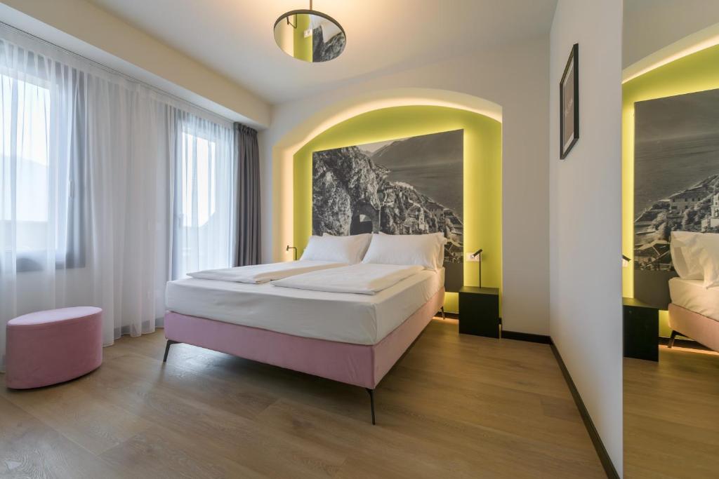 Łóżko lub łóżka w pokoju w obiekcie Hotel Villa Dirce