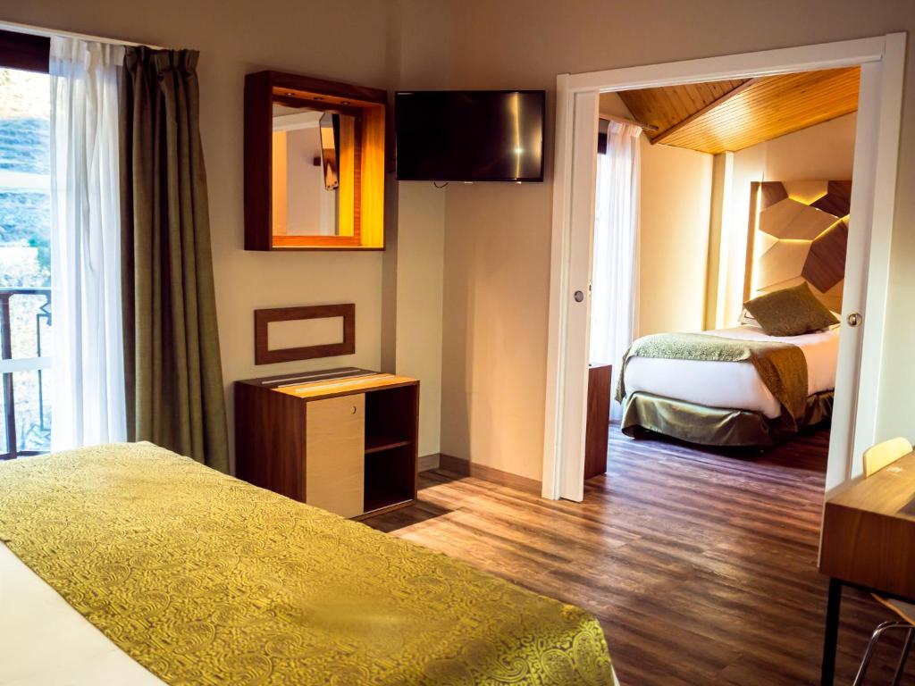 Postel nebo postele na pokoji v ubytování Hotel Princesa Parc