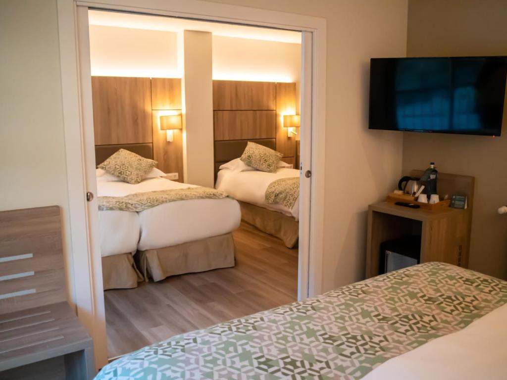 Postel nebo postele na pokoji v ubytování Hotel Princesa Parc
