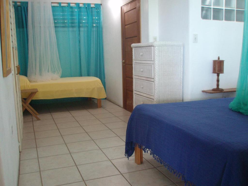 Postel nebo postele na pokoji v ubytování The Nest Tobago Apartments