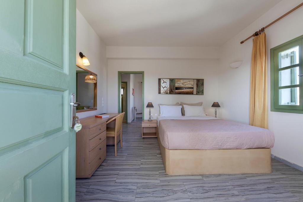 Postel nebo postele na pokoji v ubytování Ambeli Apartments