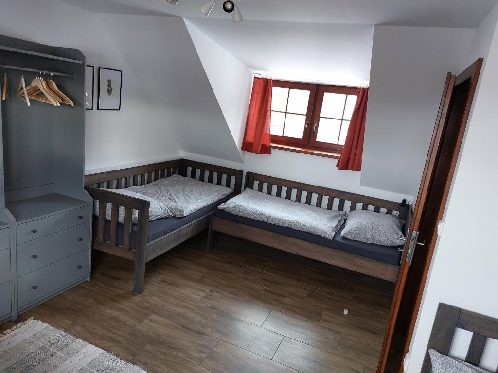 Postel nebo postele na pokoji v ubytování U Středohoře
