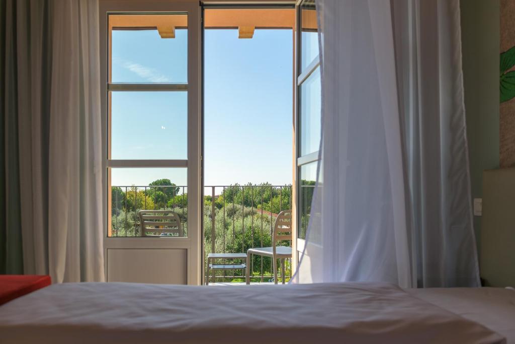 Postel nebo postele na pokoji v ubytování Regina del Garda Suite