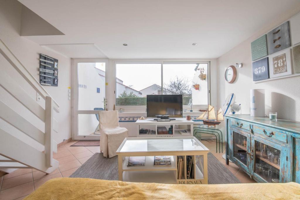 Et tv og/eller underholdning på Maison dans résidence calme + piscine à Pornic