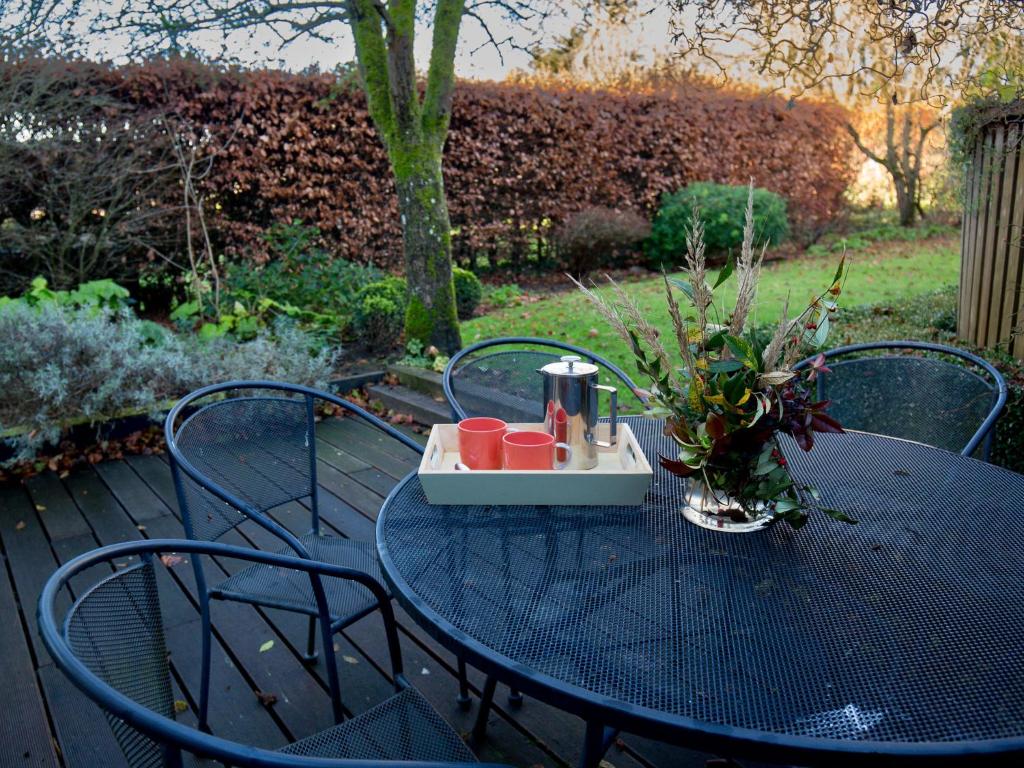 a blue table with a tray of drinks on it at Betty's Cottage in Burford
