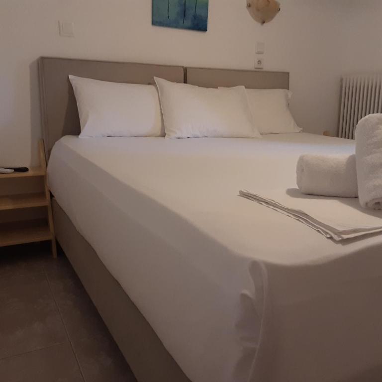 Postel nebo postele na pokoji v ubytování Parselia Rooms