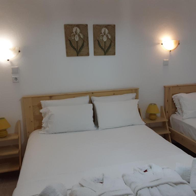 Postel nebo postele na pokoji v ubytování Parselia Rooms