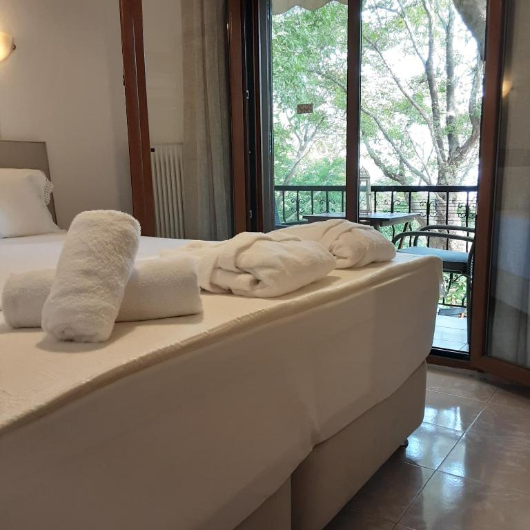 Postel nebo postele na pokoji v ubytování Parselia Rooms
