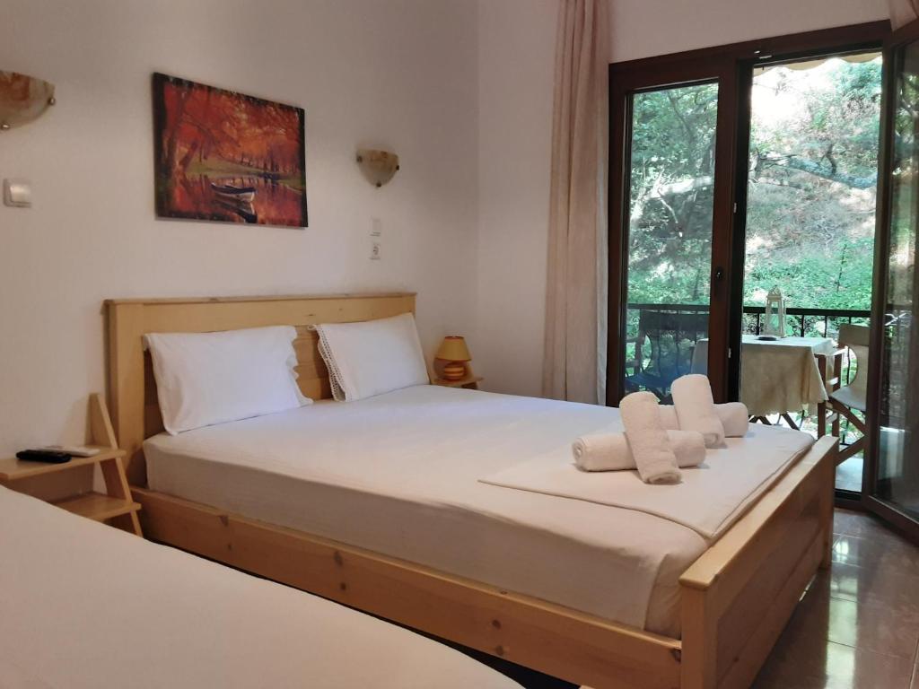 Postel nebo postele na pokoji v ubytování Parselia Rooms