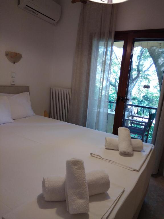 Postel nebo postele na pokoji v ubytování Parselia Rooms