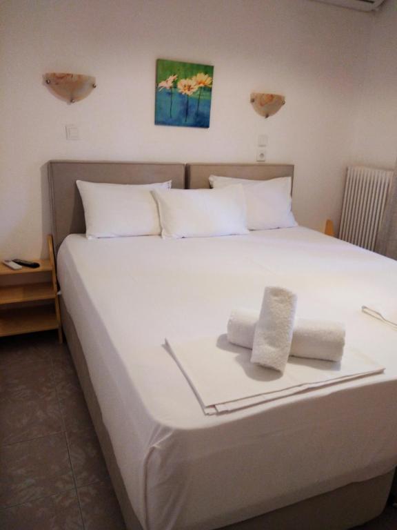 Postel nebo postele na pokoji v ubytování Parselia Rooms