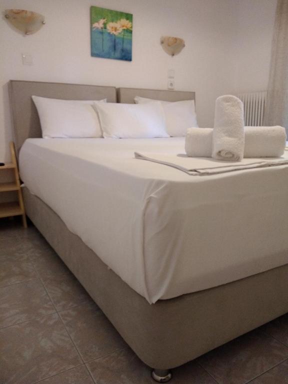 Postel nebo postele na pokoji v ubytování Parselia Rooms