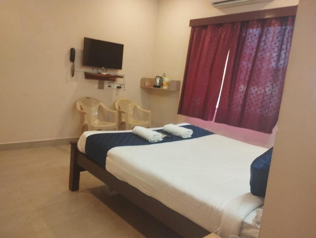 Postel nebo postele na pokoji v ubytování Grand Ocean inn