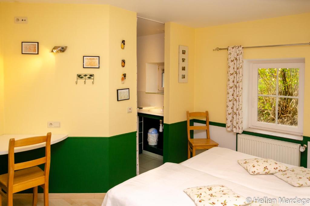 Postel nebo postele na pokoji v ubytování La Marguerite