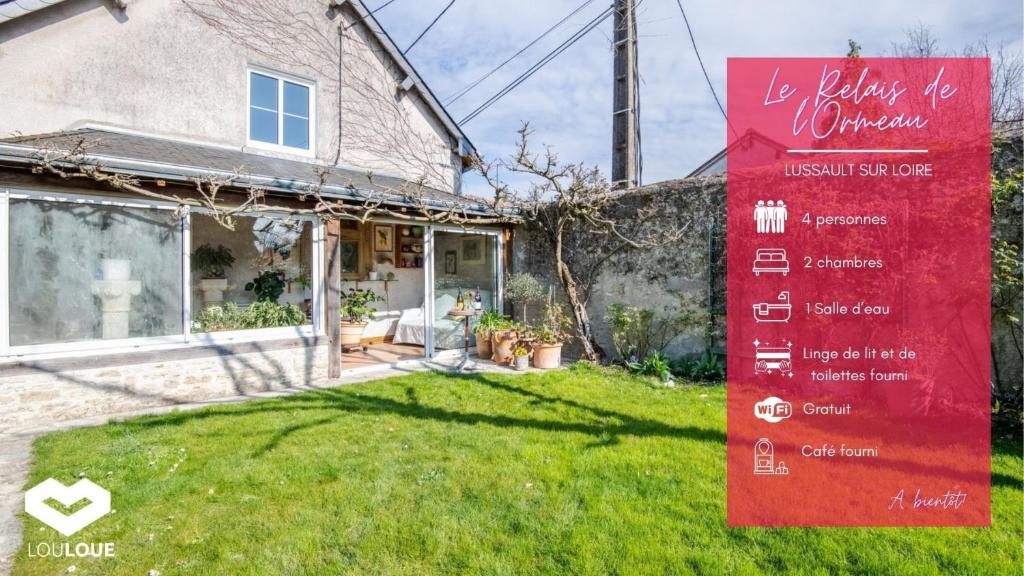 una casa con una señal roja en el patio en Le Relais de l'Ormeau - Charmant gîte pour 4 pers. en Lussault-sur-Loire