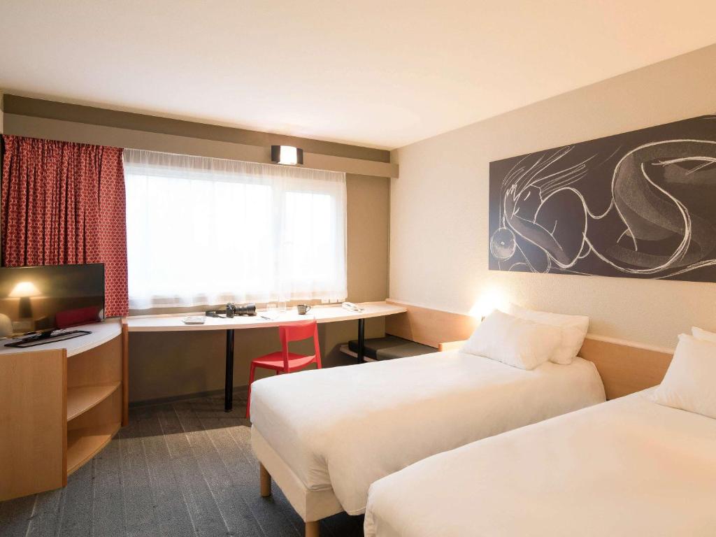Postel nebo postele na pokoji v ubytování ibis Metz Nord