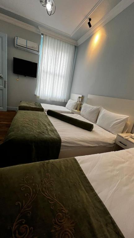 Postel nebo postele na pokoji v ubytování Bali Star City Hotel