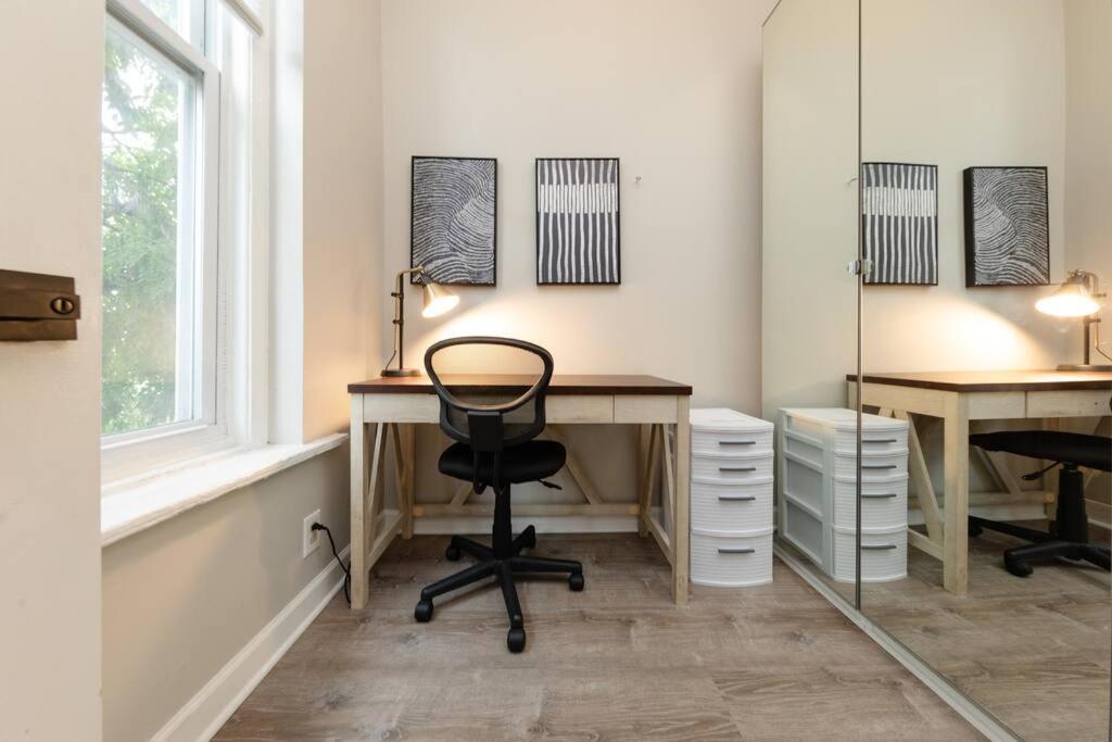 a home office with two desks and a chair at The Secret West Loop Oasis in Chicago