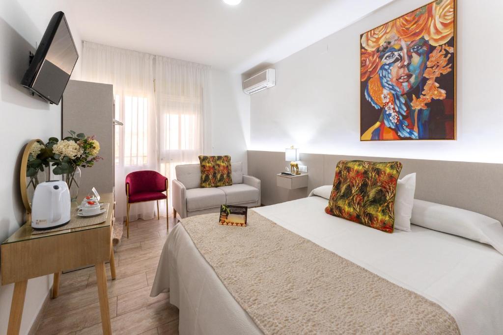 a bedroom with a bed and a living room at Urban Rooms B&R in Málaga