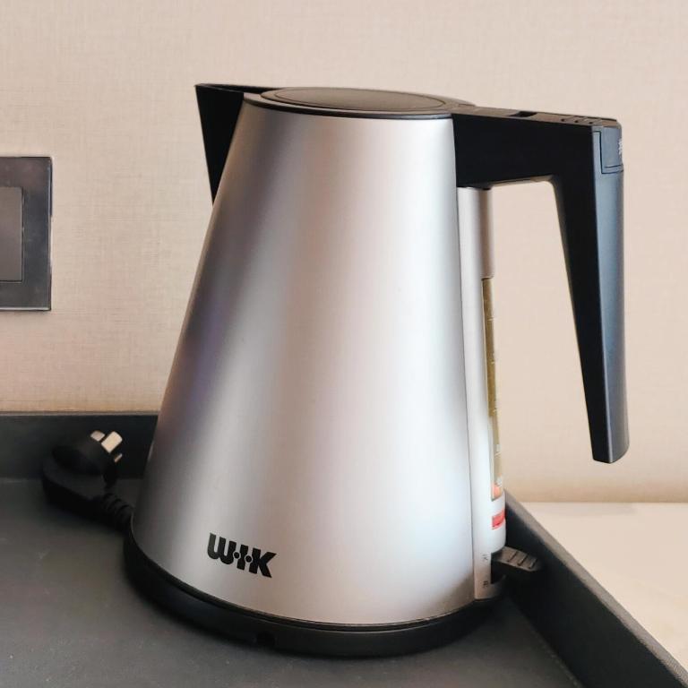 Příslušenství pro přípravu čaje a kávy v ubytování The Yun Hotel Foshan Nanhai-Near Pazhou Complex
