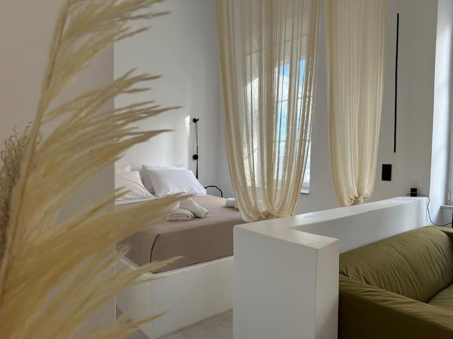Postel nebo postele na pokoji v ubytování Fouli,Syros Apartment,Ermoupoli