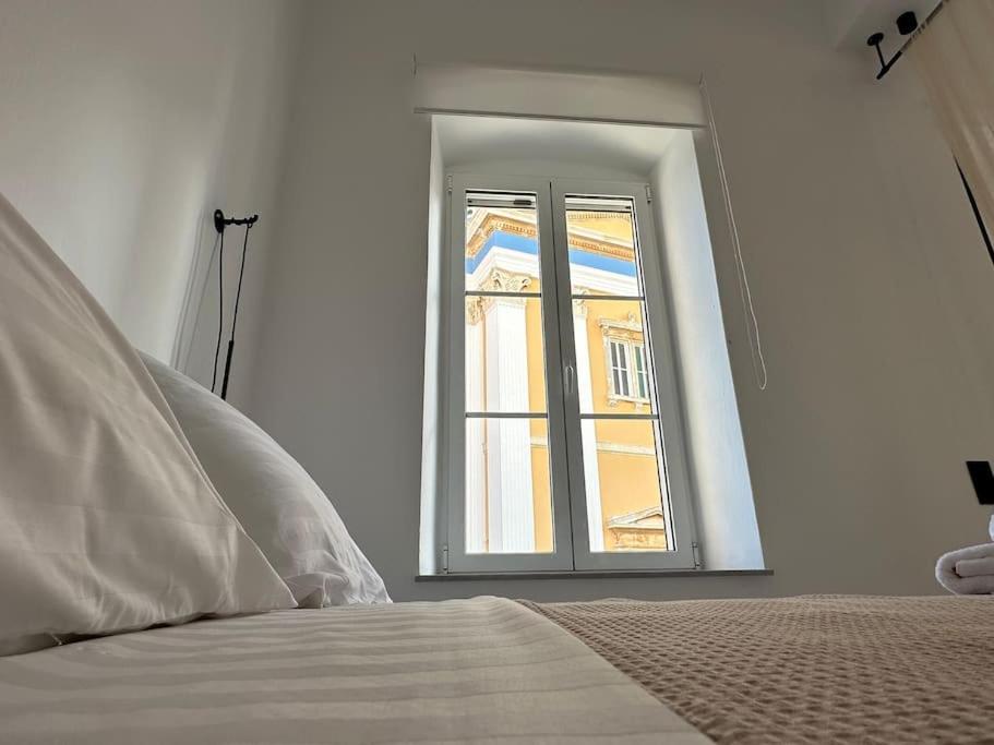 Postel nebo postele na pokoji v ubytování Fouli,Syros Apartment,Ermoupoli