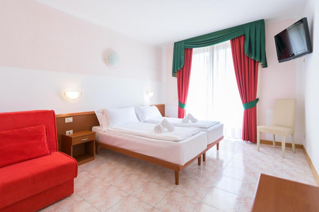 Postel nebo postele na pokoji v ubytování Hotel Garda Bellevue