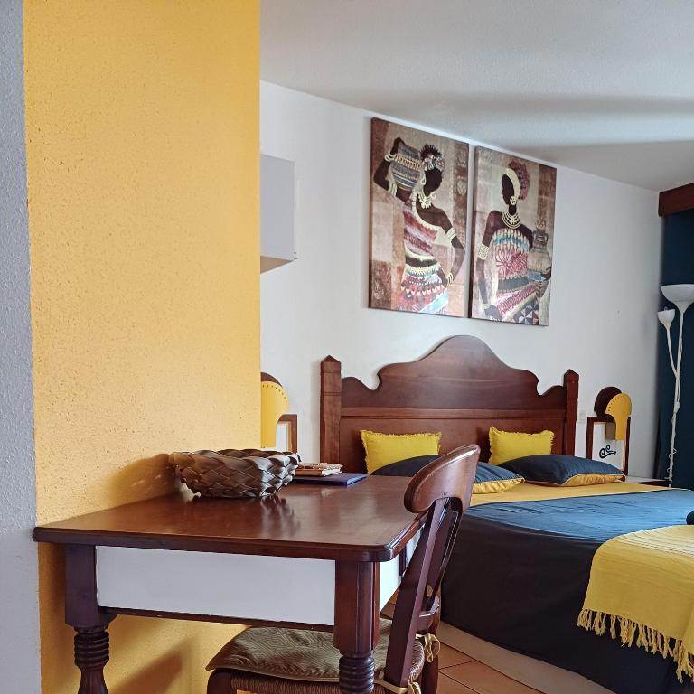 Postel nebo postele na pokoji v ubytování Au petit Régal