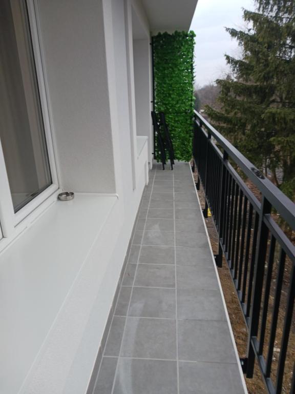 a walkway on a balcony of a house at APARTMÁN in Turčianske Teplice