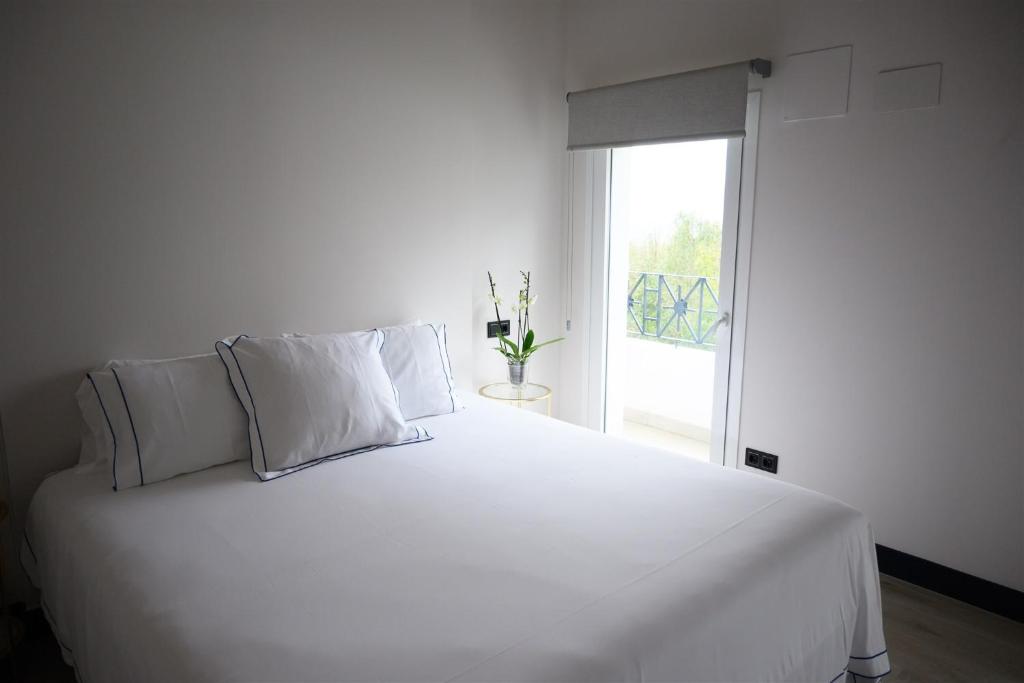 Postel nebo postele na pokoji v ubytování Neguetxea Boutique Guest House