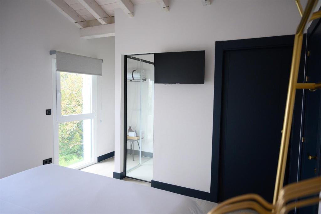 Postel nebo postele na pokoji v ubytování Neguetxea Boutique Guest House