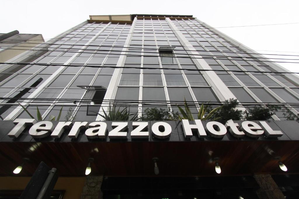 a sign on the facade of a ferazquez hotel at Terrazzo Hotel in Campos dos Goytacazes