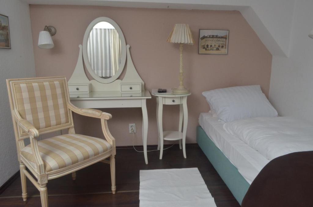 Postel nebo postele na pokoji v ubytování Hotel Graupner