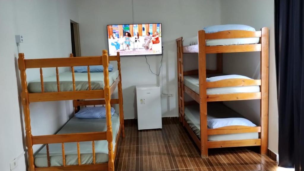 Postel nebo postele na pokoji v ubytování Pousada Do Léo