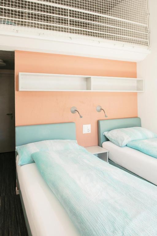 Postel nebo postele na pokoji v ubytování Centro Magliaso