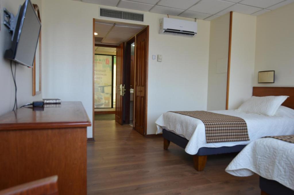Postel nebo postele na pokoji v ubytování Tur Hotel Santiago