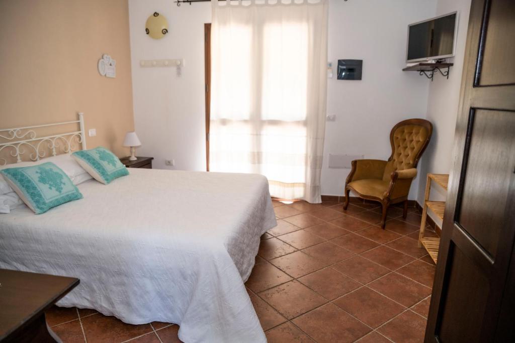 Postel nebo postele na pokoji v ubytování Agriturismo Sa Mendhula