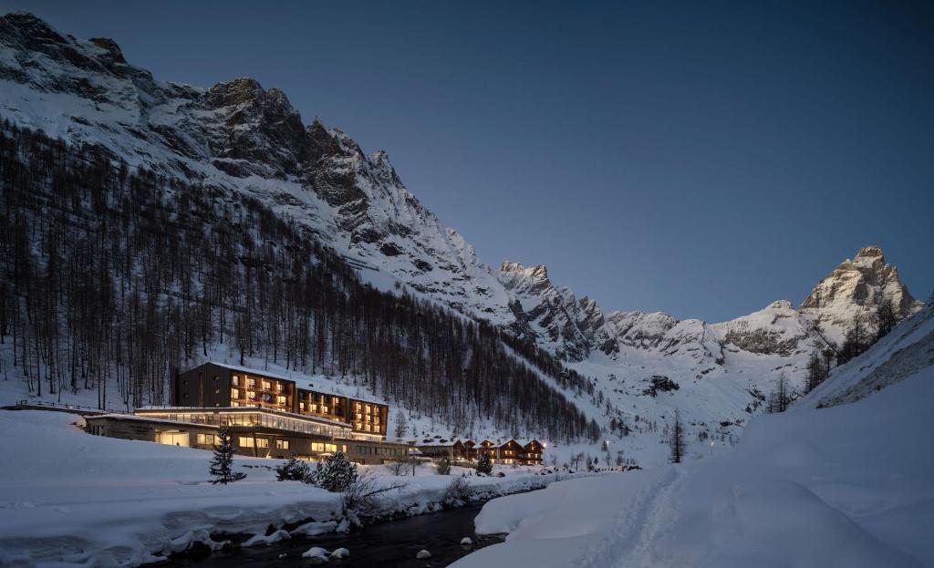 a building in the middle of a snow covered mountain at Cervino - VRetreats in Breuil-Cervinia