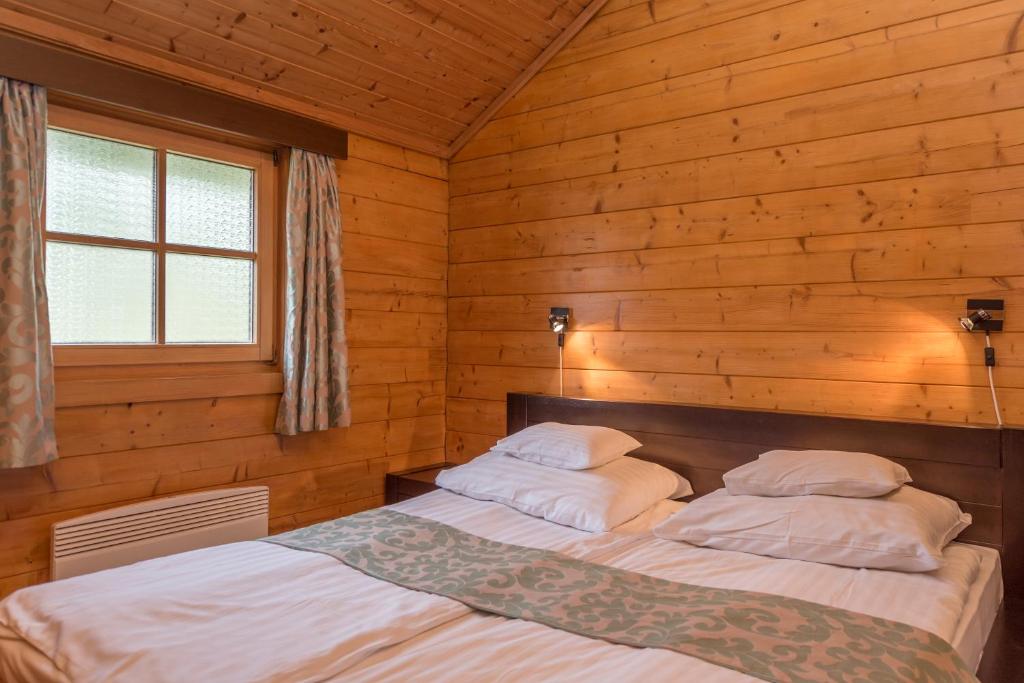 Postel nebo postele na pokoji v ubytování Petneházy Aparthotel