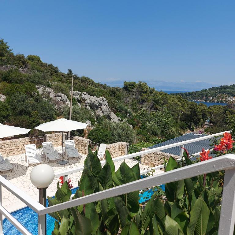 a view from the balcony of a villa with a swimming pool at Villa Šolta in Rogač