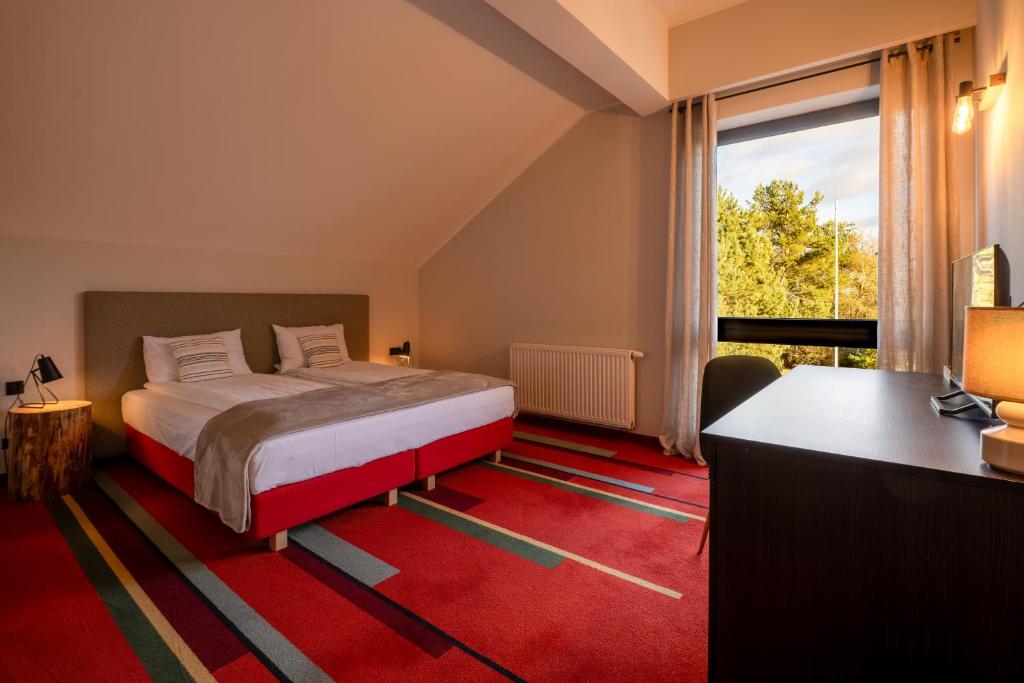 Postel nebo postele na pokoji v ubytování Hotel i Restauracja Czarny Kos