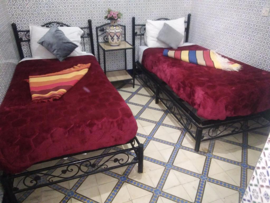 Postel nebo postele na pokoji v ubytování HOTEL EL AMAL