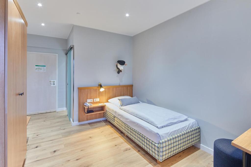 Postel nebo postele na pokoji v ubytování Hotel Sonneck
