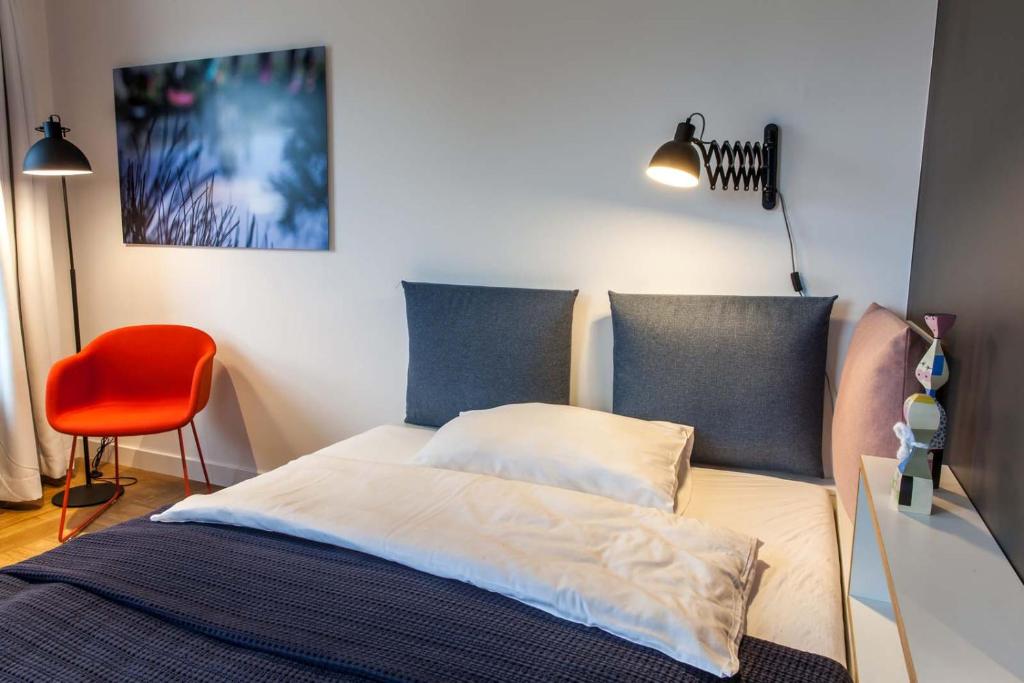 Postel nebo postele na pokoji v ubytování smartments Wien Hauptbahnhof - Serviced Apartments