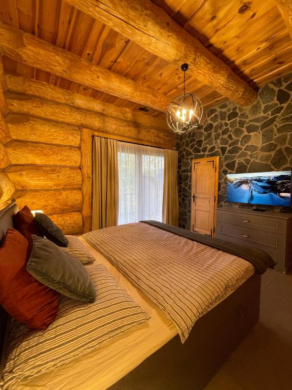 Postel nebo postele na pokoji v ubytování Zrub Mrázik